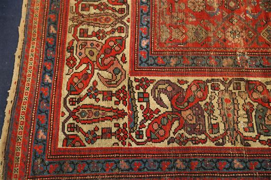 An antique Malayer carpet, dated 1905, 14ft 3in by 10ft 4in.